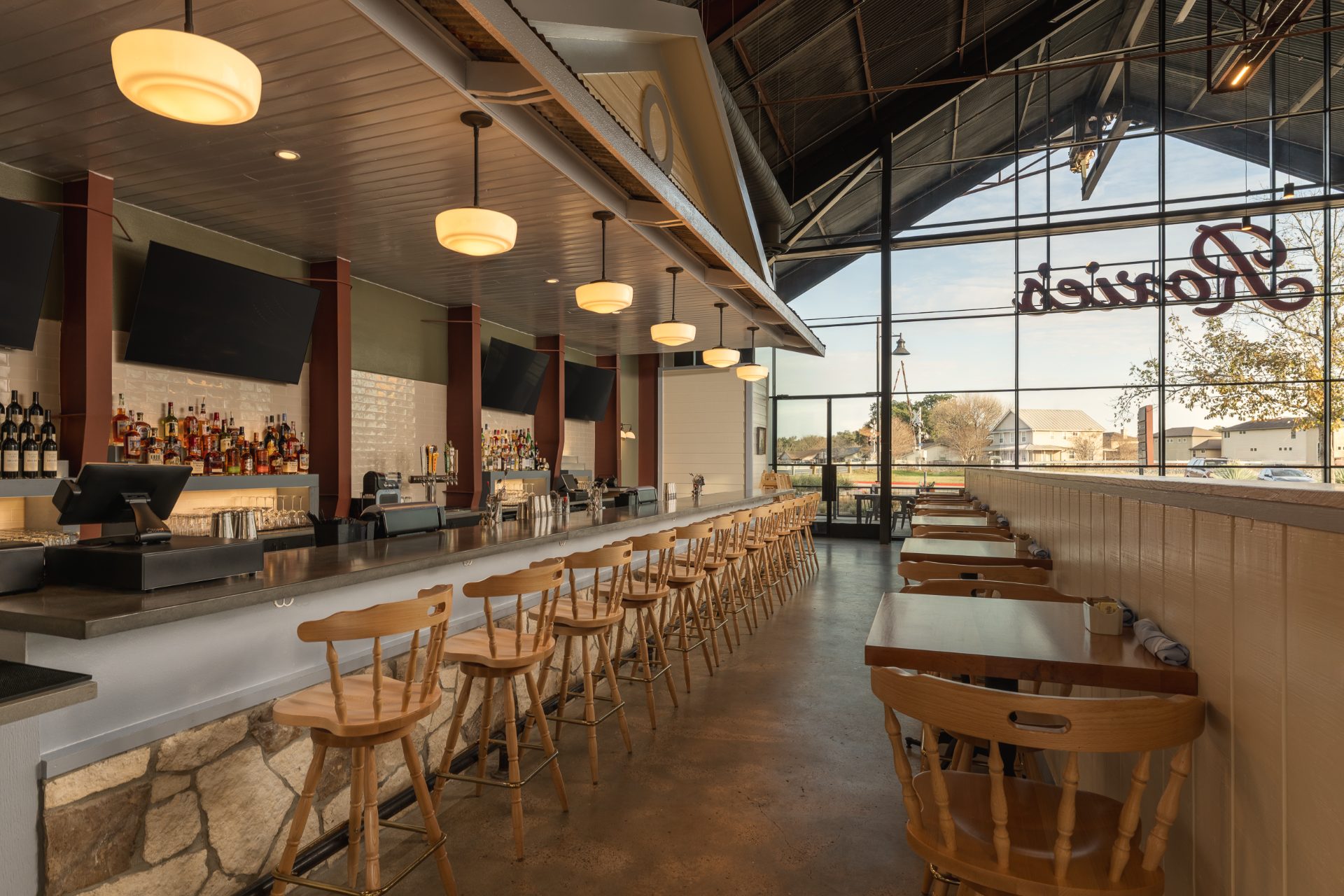 Roxie's at Buda Mill, bar area with steel trusses